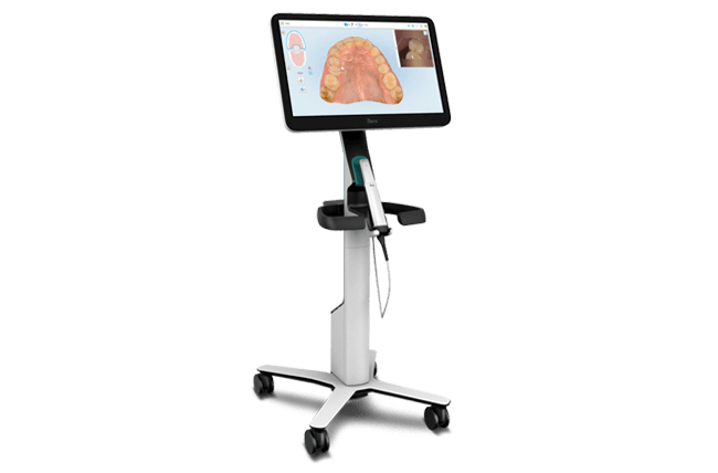 iTero intraoral scanner showing a 3D dental scan on its screen